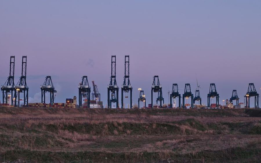 Container cranes at a port at dusk